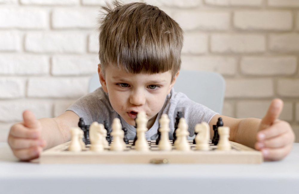 medium-shot-child-playing-chess (1)